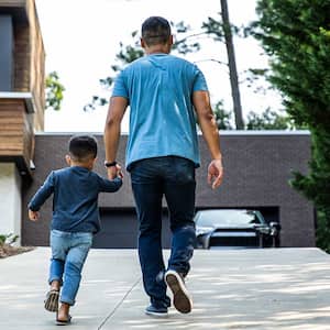 Father and son walking home