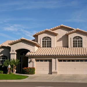 A two story house with a tiled roof