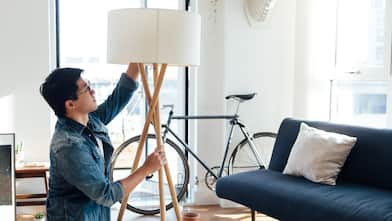 A man changing a light bulb