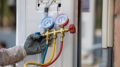 A technician checking new air conditioner