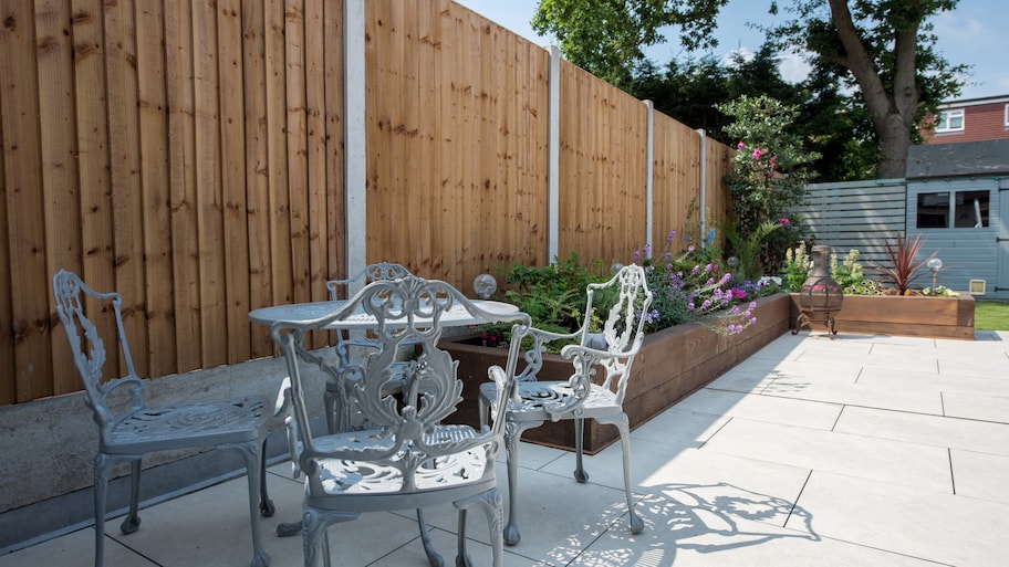 Wood fence with metal post connectors