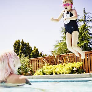  A mother and daughter enjoying a swimming pool