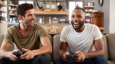 Two friends playing video games in basement