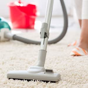 Suction grey carpet cleaning with vacuum cleaner