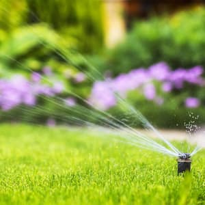 automatic sprinkler system watering the lawn