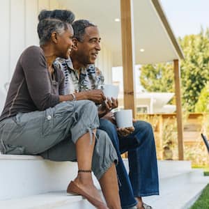 Couple drinking coffee on porch