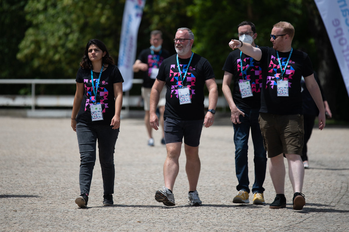 Communication Team walking outside, Steve giving directions