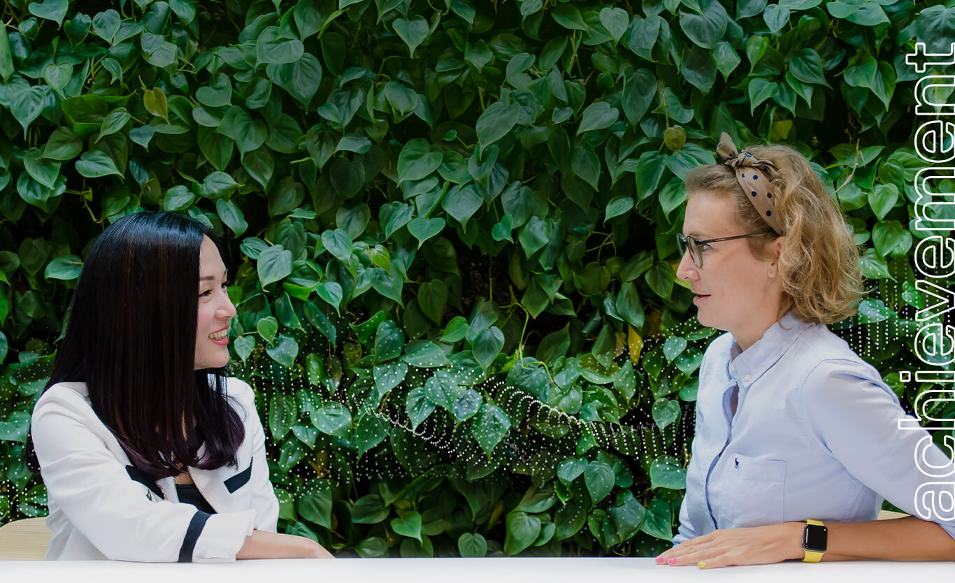 Two women talking face to face