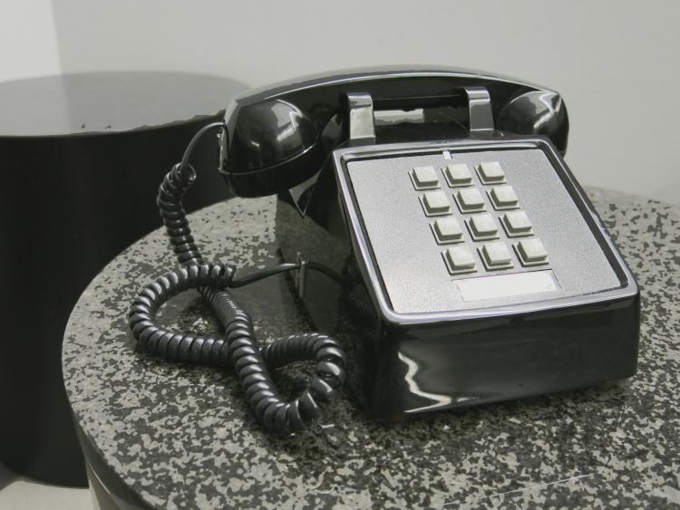 Black push button phone.