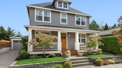 Exterior view of a house with concrete steps