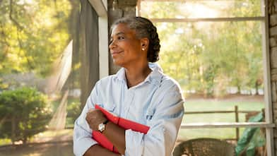 Smiling woman on screened-in porch