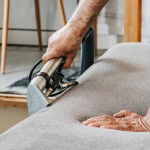 A close up of a professional upholstery cleaning service