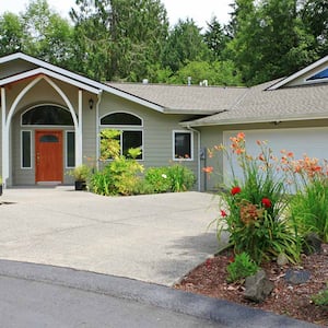 Beautiful clean beige house and driveway