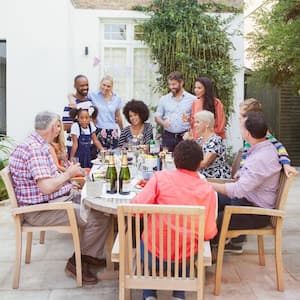 A family dinner in a pavers patio in the backyard