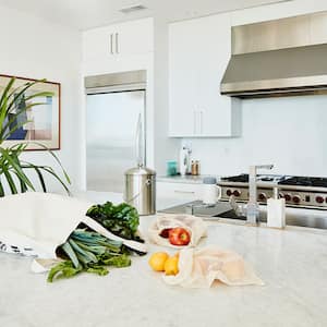 A view of produce on a counter in a white kitchen