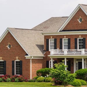 A large brick house with a yard