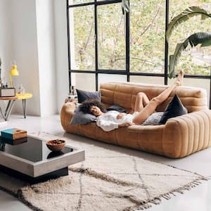 A young woman taking a nap at her couch