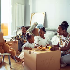 Family having breakfast in their new home