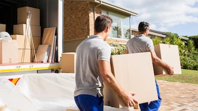 Movers carry boxes