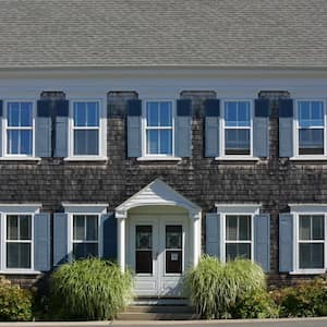 A traditional Cape Cod house with shingle siding