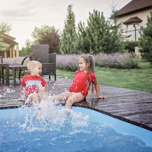 boy and girl playing in the pool