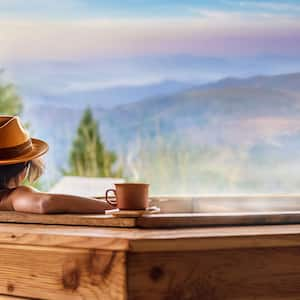 Woman with hat relaxing in a hot tub