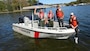 Preston Brust (second from right) and Chris Lucas (Right) of the country music duo LoCash pose with U.S. Army Corps of Engineers Park Rangers Jacob Albers (Left) and Brent Sewell at Old Hickory Lake in Hendersonville, Tenn, Oct. 19, 2015.  The group filmed a water safety PSA that features LoCash’s hit song "I Love This Life," which is currently moving up the country music charts. It is being used to support the USACE National Water Safety Campaign “Life Jackets Worn, Nobody Mourns.”