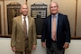 Mike Wilson (Right) and Mark Kuhlo, 2021 Distinguished Civilian Employee Recognition Award recipients, pose by their nameplates on a bronze plaque highlighting their recognition Oct. 6, 2021 at the Nashville District Headquarters in Nashville, Tennessee. Wilson retired in 2017 following 42 years of federal service, culminating his career as deputy district engineer for Project Management. Kuhlo retired in 2016 following 35 years of federal service, culminating his career as chief of the Electrical and Mechanical Branch. (USACE Photo by Lee Roberts)