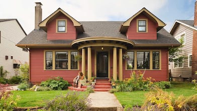 Woman and dog sitting on the porch