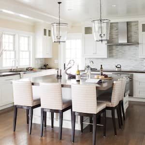 white kitchen cabinets and island with stools