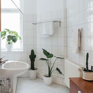 spacious white tile bathroom 