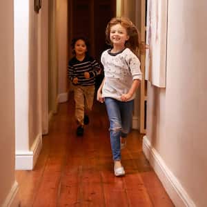 Kids running down hallway with wood floors