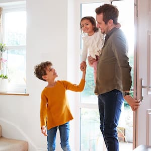 Family walking in front door