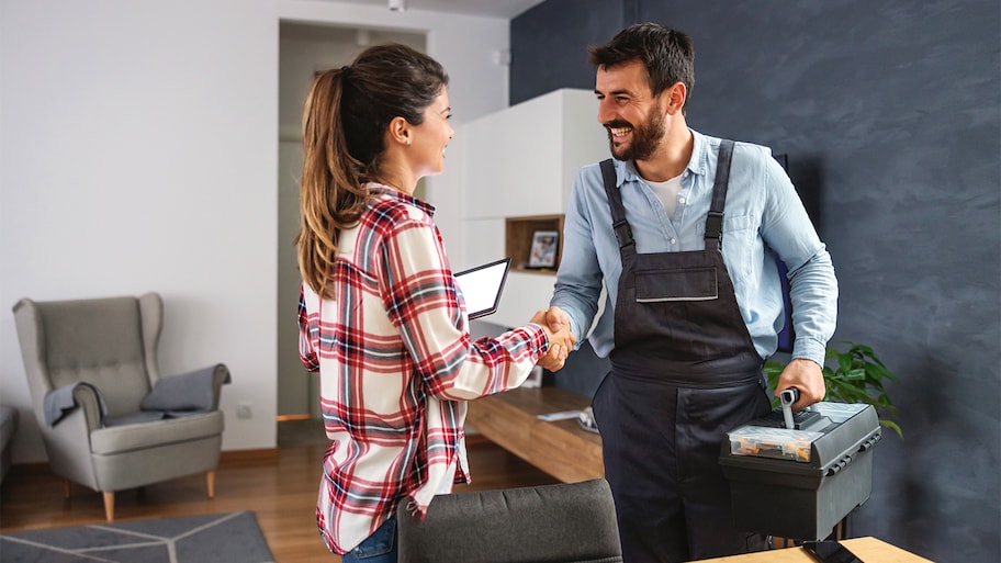 woman conducting business with repairman