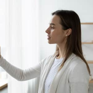 Woman using smart home system