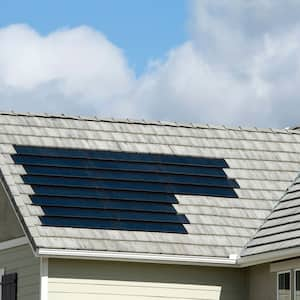 A house with solar shingles on its roof