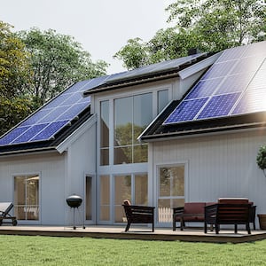 white home with solar panel on roof  