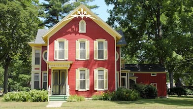 Red Victorian home in peaceful setting