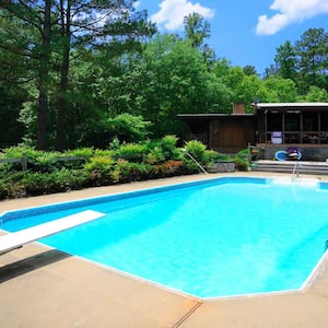 A pool in the backyard of a house