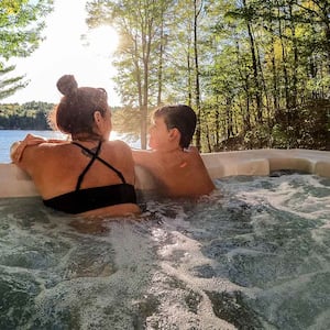 Mother and son in hot tub