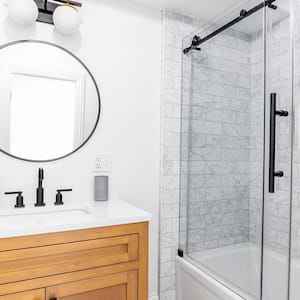 A view of a bathroom with a tiled shower