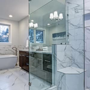 A master bathroom with marble tile