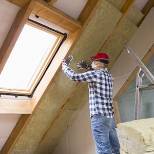 Man installing thermal insulation