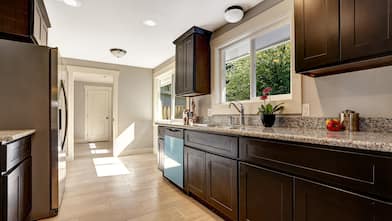 Modern kitchen interior with stained cabinets