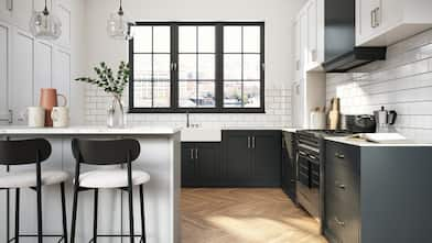 A modern kitchen with black and white cabinets