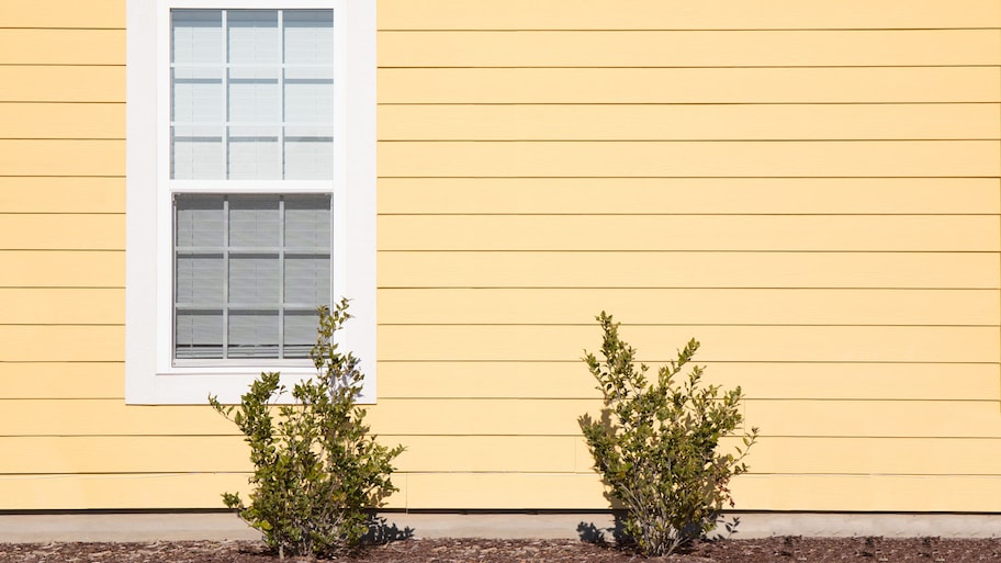 A solitary window on the exterior of a house