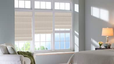 windows with striped Roman shades