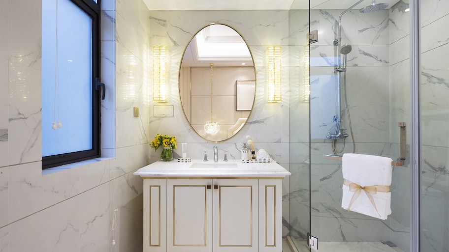 bathroom with round vanity and recessed lights