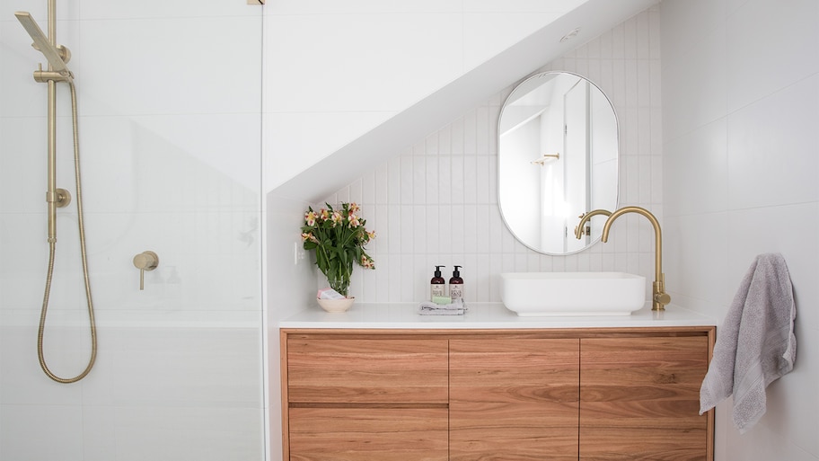 white bathroom with round mirror