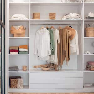 A white wardrobe with shelves filled with clothes and shoes